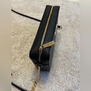 Black Michael Kors bag.